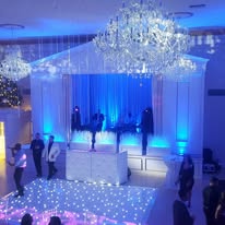 Dance floor with blue lights at The Commons 1854 reception