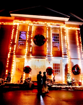 The Commons 1854 decorated with Christmas lights at night